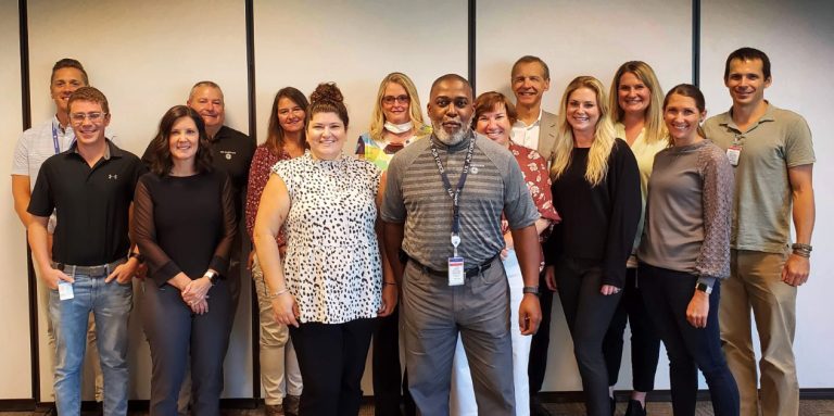 From Left to Right: Eric Hart, Franco Rupcich, Carrie Bartels, Duane Burns, Pamela McNicol, Jenny Hipp, Jeannie Mims, Craig Johnson, Dawn Strickland, Myron Pozniak, Hailey Holda, Rachel Bladorn, Amanda Ciano, Tim Szczykutowicz.